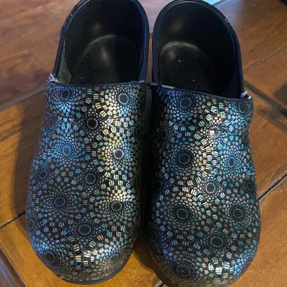 Dansko clogs used. Still lot of life left in them. Size 39.